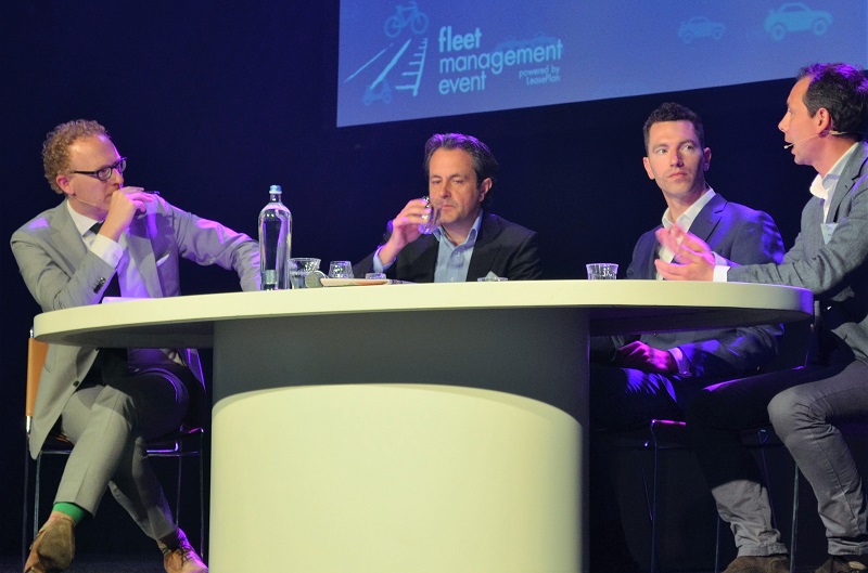 Rens de Jong (l) tijdens de openingstalkshow met (vlnr) Carlo van de Weijer (TUe), Daan Bieleveld (DSM) en Jean Paul van Schoonhoven (PostNL)